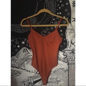 Orange body suit